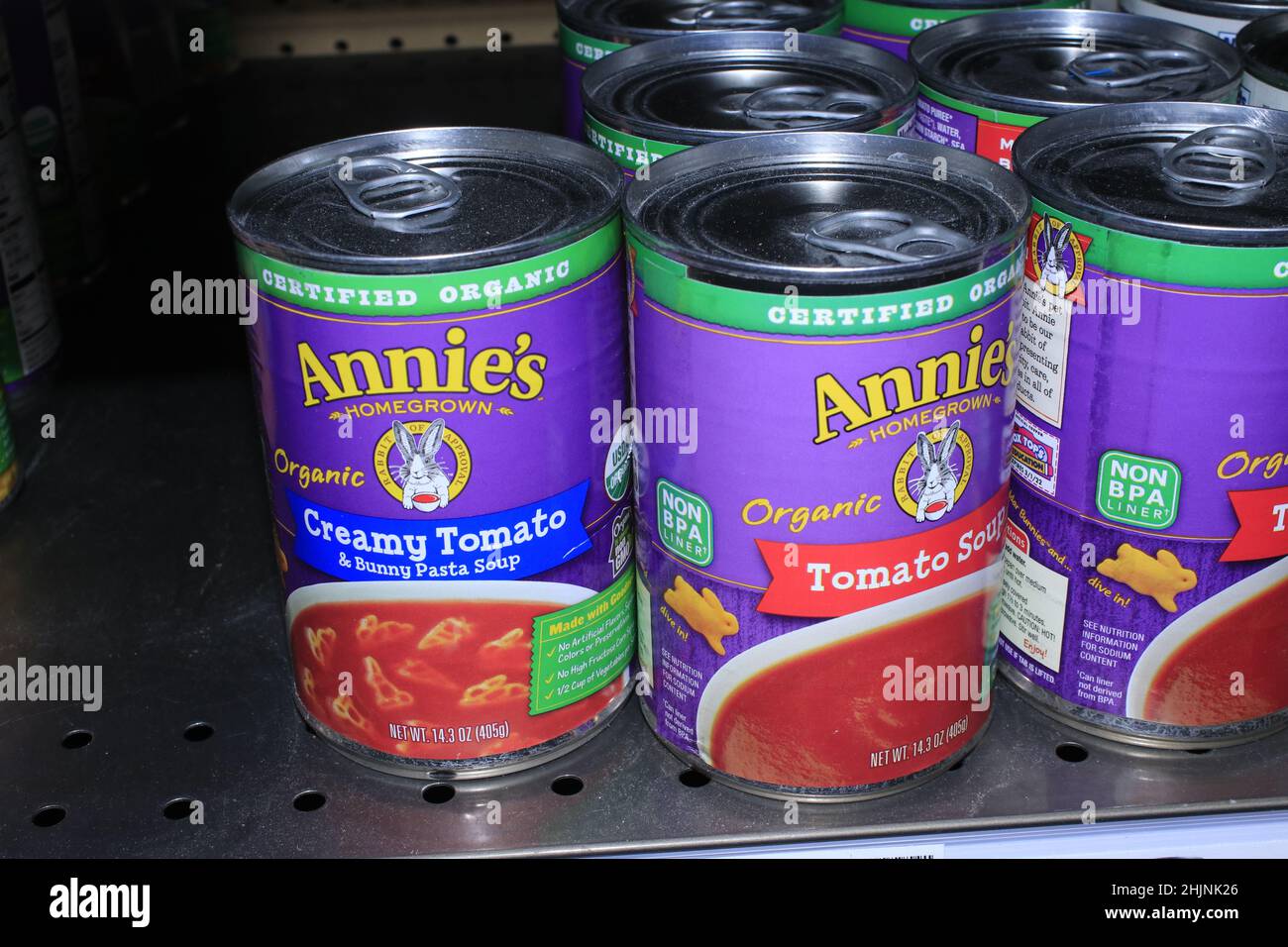 A closeup shot of Annie's Tomato Soup on a metal shelf at a  Dillons grocery store on a metal shelf in Kansas Stock Photo