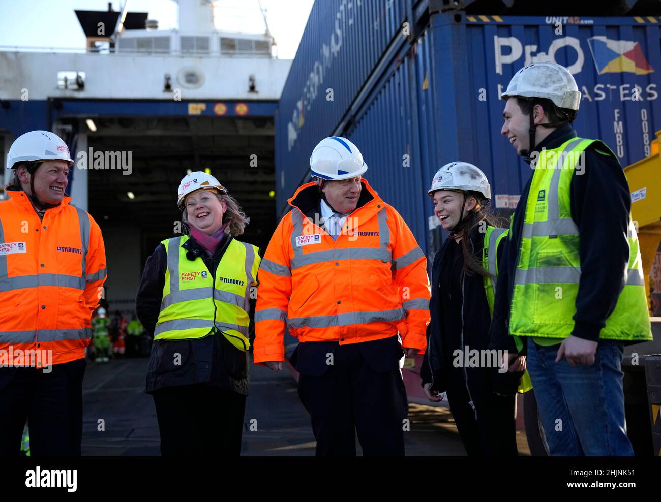 Prime Minister Boris Johnson (centre) Charles Hammond, Group CEO Forth Ports (left), and MP Jackie Doyle Price (second left) speak with port workers during a visit to during a visit to the Tilbury Docks in Essex. Picture date: Monday January 31, 2022. Stock Photo