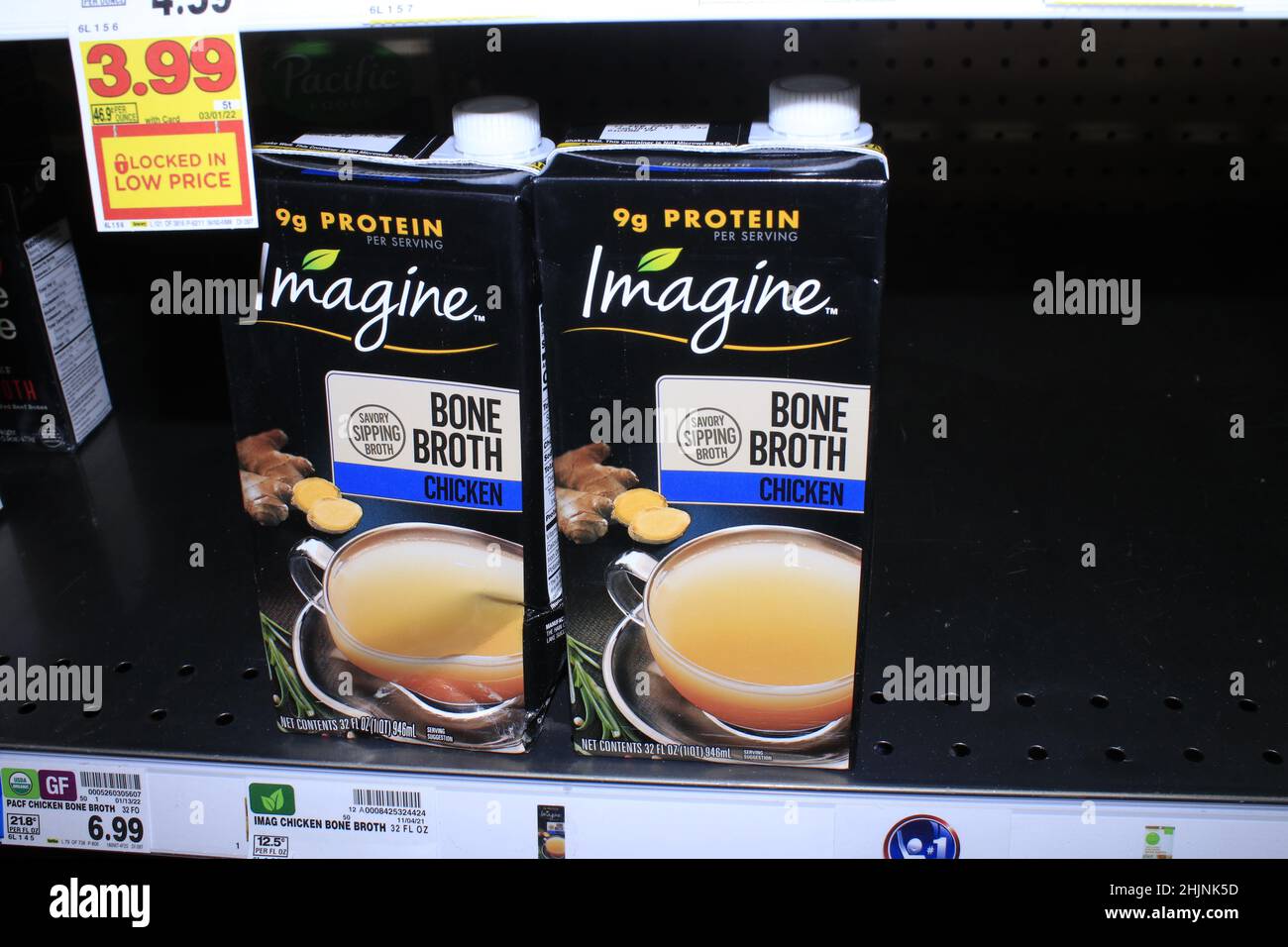 A closeup of Imagine Chicken Bone Broth on a metal shelf at a Dillons
