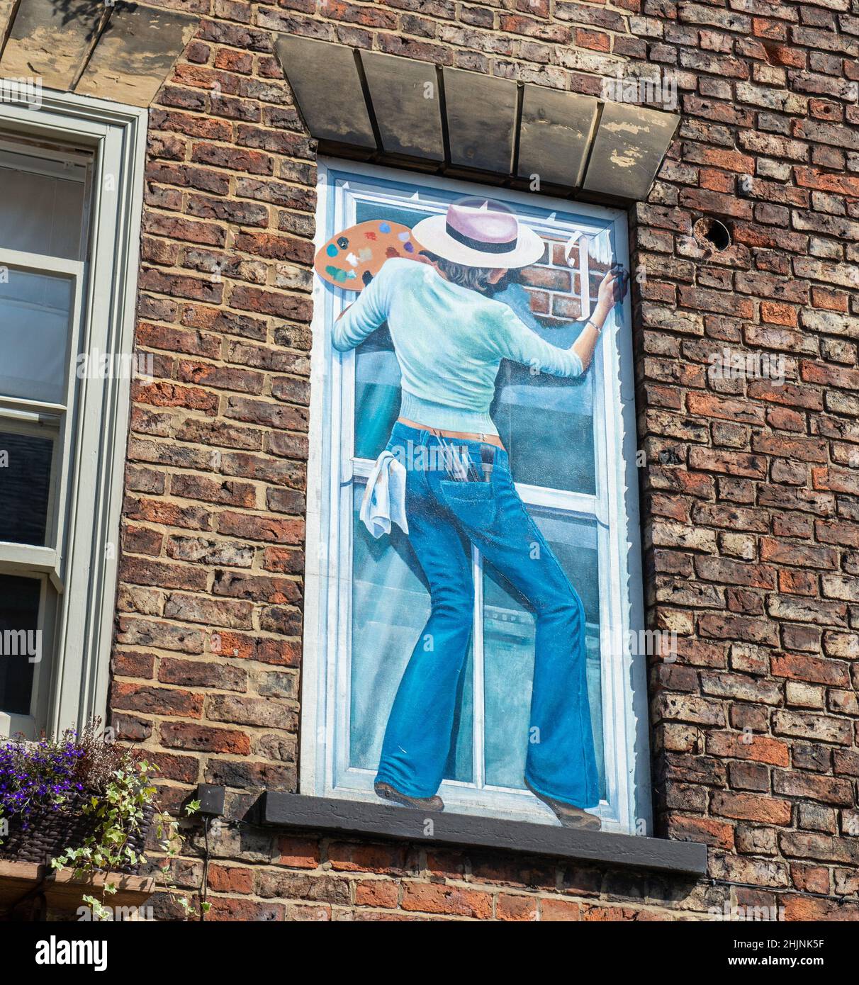 Self portrait of the artist -part of the Town Windows trompe-l'oeil mural project in Knaresborough, North Yorkshire Stock Photo