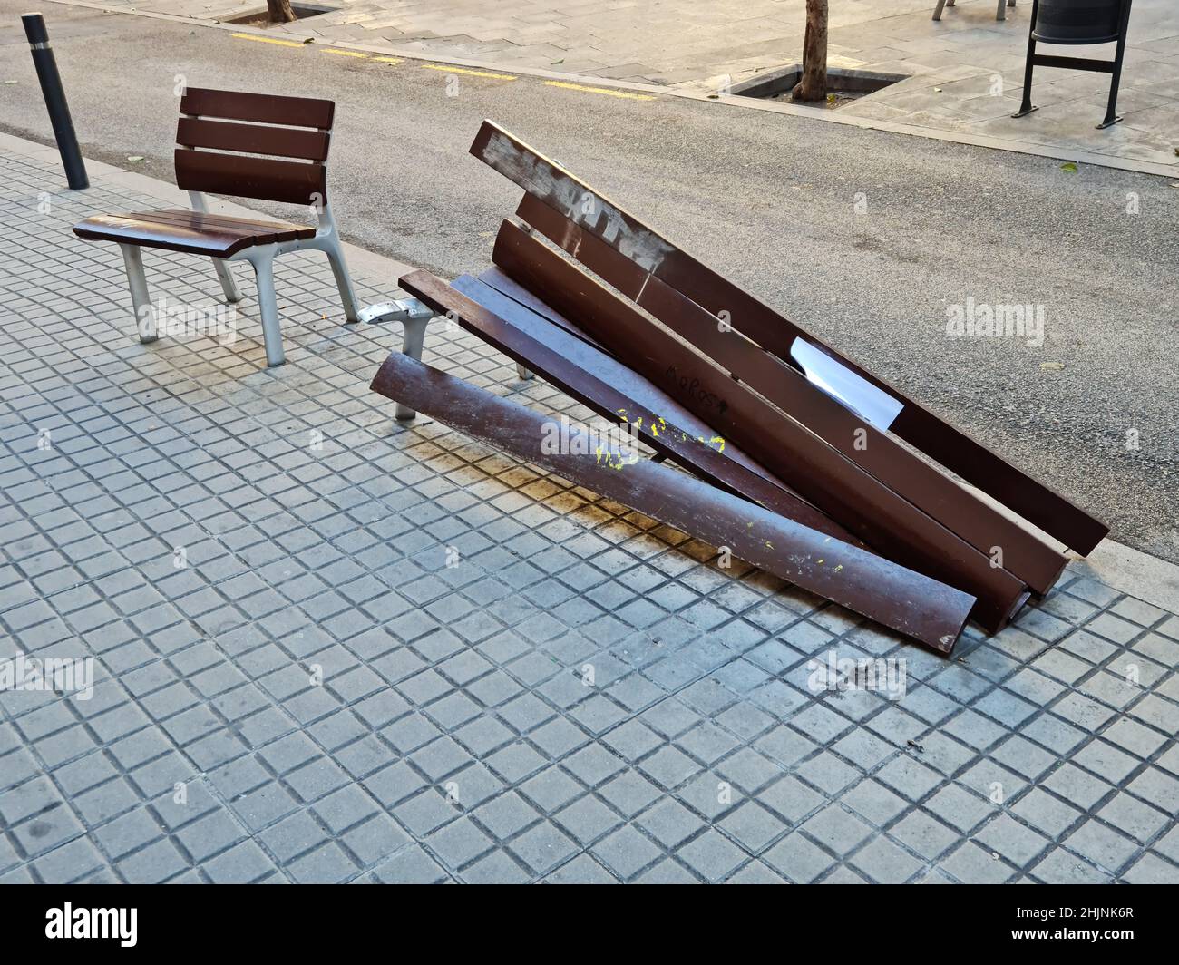 Urban vandalism. Destroyed public bench. Stock Photo