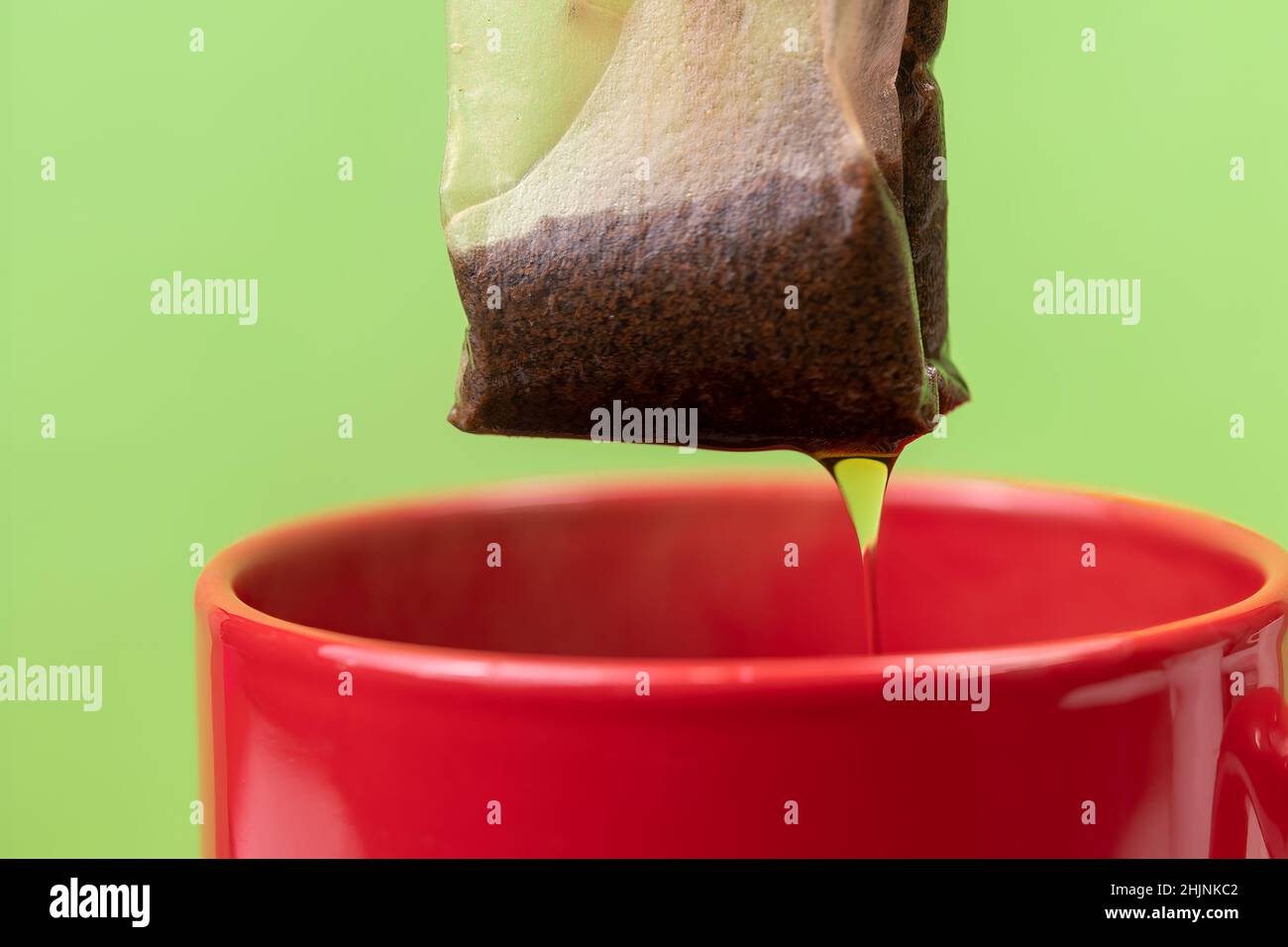 Preparing hot black tea in a mug Stock Photo Alamy