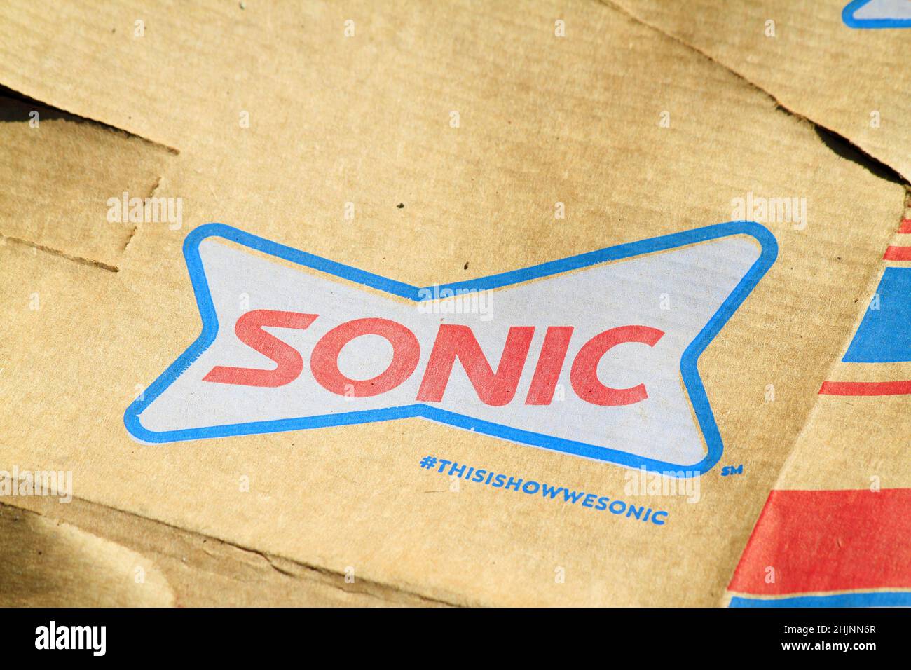 A closeup of a Advertisement on a box with a colorful SONIC logo with a brown background in Kansas Stock Photo