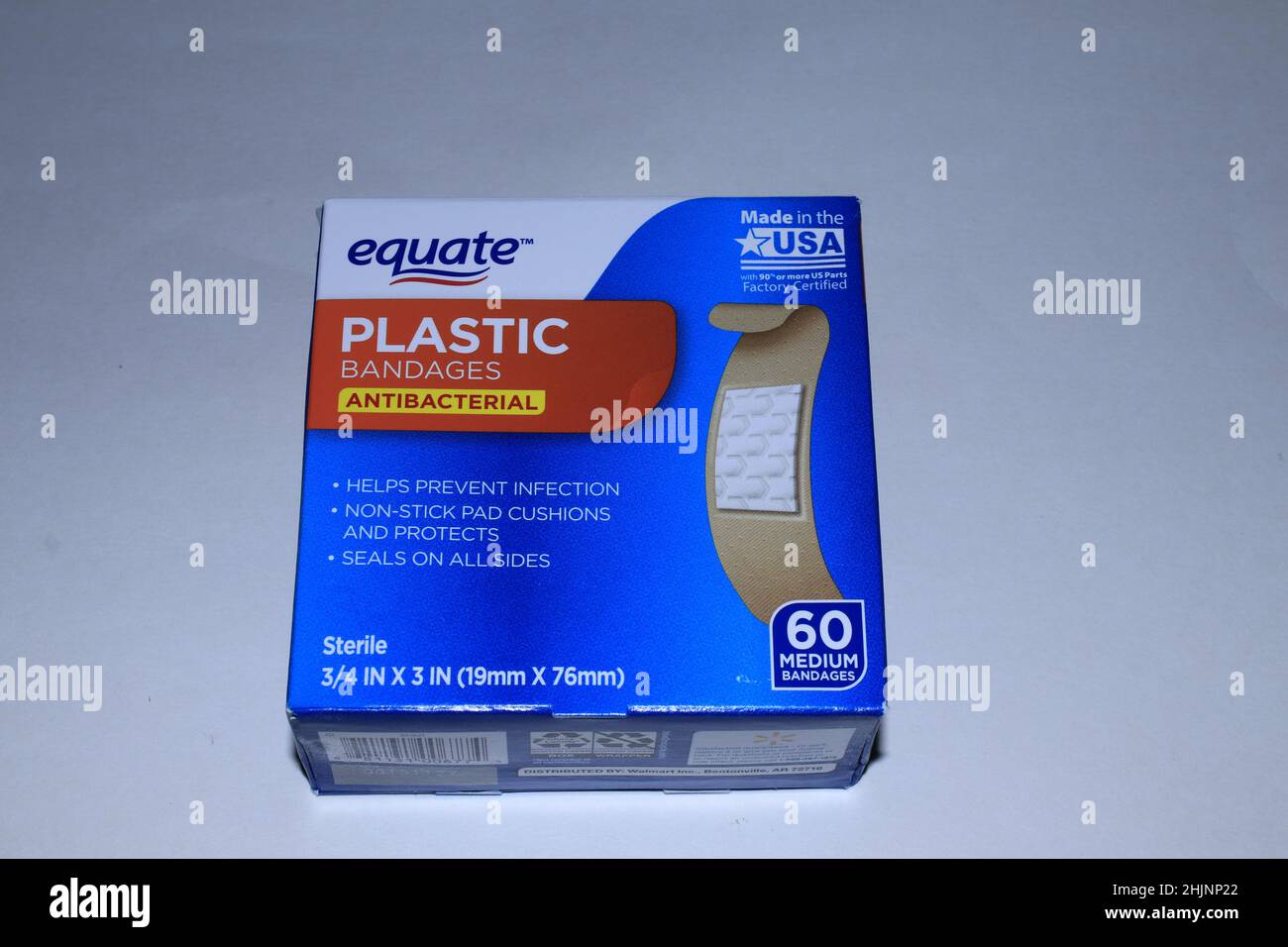 A closeup of equate plastic Antibacterial Band aids in a box shot closeup that's bright and colorful with a white background in Kansas Stock Photo