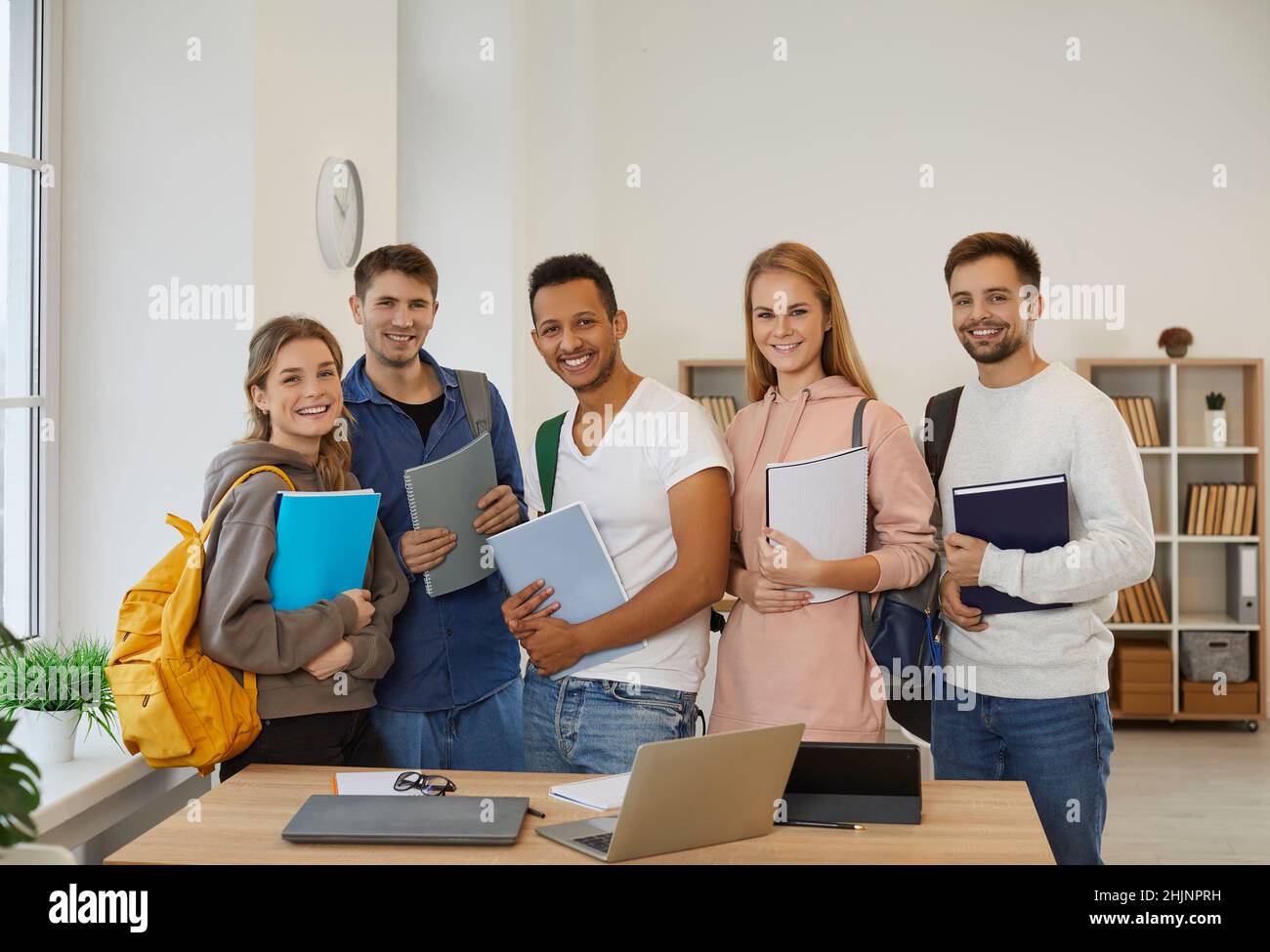 Group portrait of happy diverse students with backpacks Stock Photo - Alamy