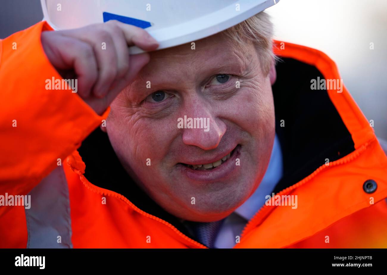 Prime Minister Boris Johnson tips his hat at the end of an interview after a visit to the Tilbury Docks in Essex. Picture date: Monday January 31, 2022. Stock Photo