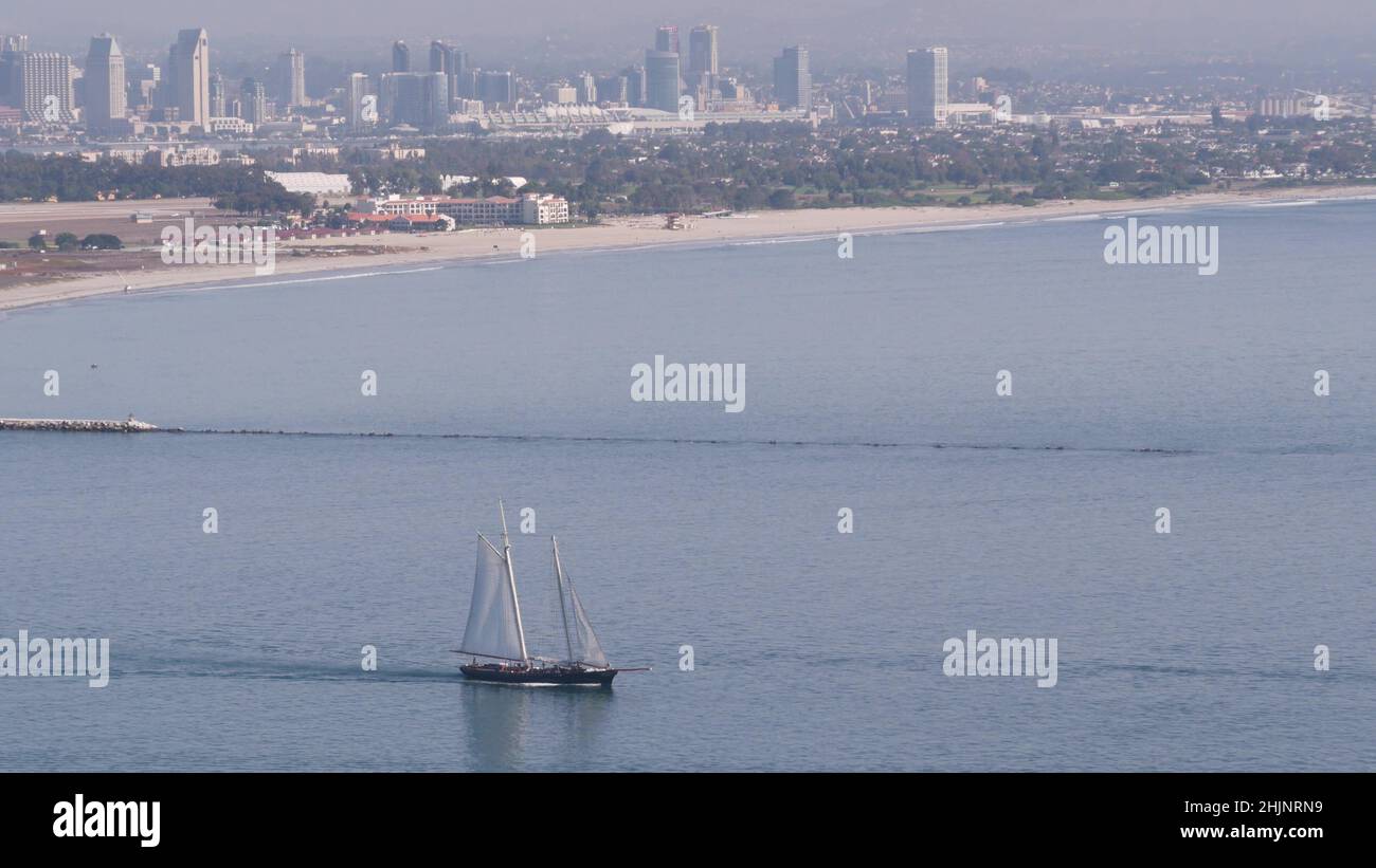 San Diego city skyline, cityscape of downtown with highrise skyscrapers, California coast, USA. View of Coronado island from above, Point Loma vista viewpoint. Frigate sail-powered ship, windjammer. Stock Photo