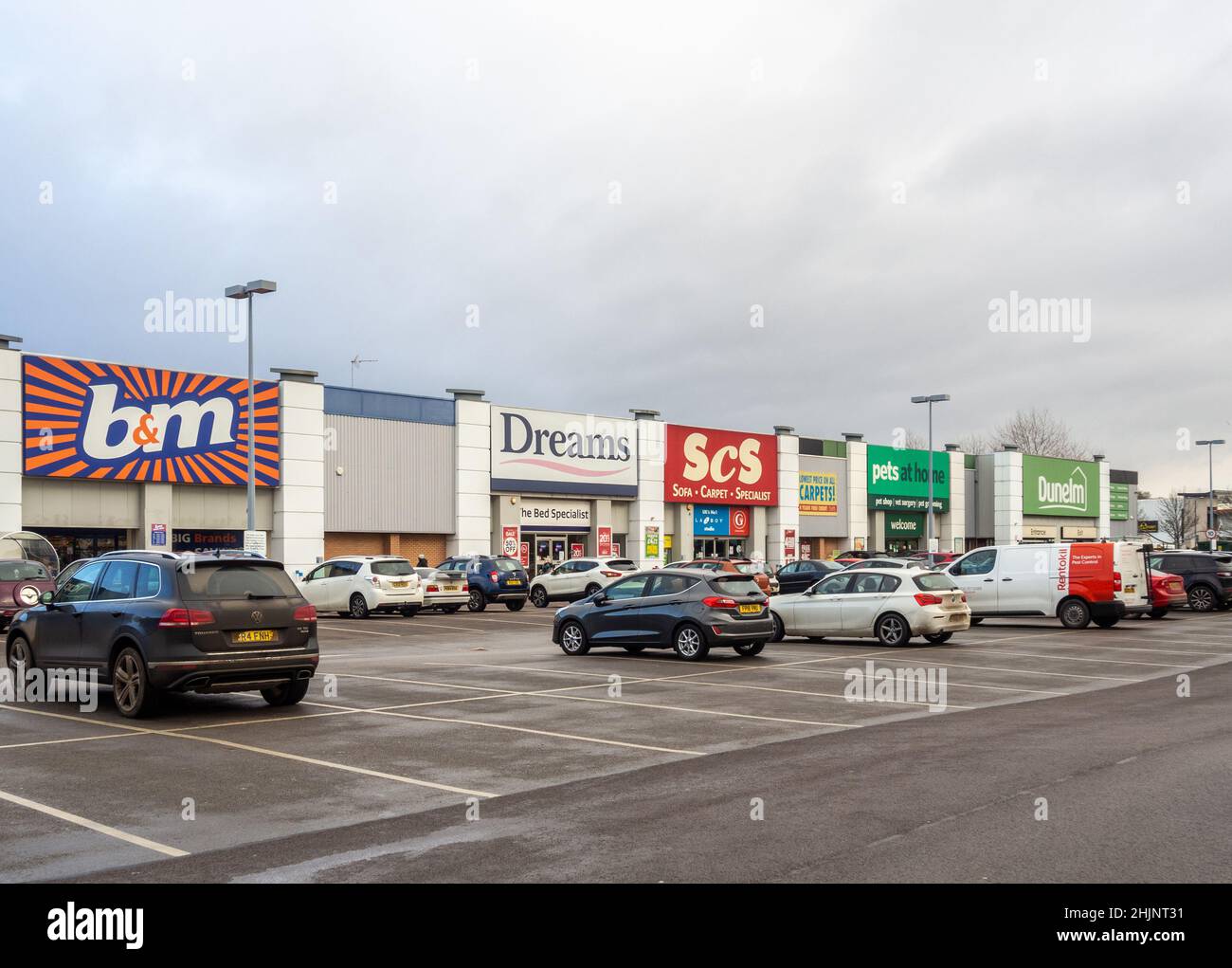 Shops at Nene Valley Retail Park with parked cars to the front, Northampton, UK Stock Photo