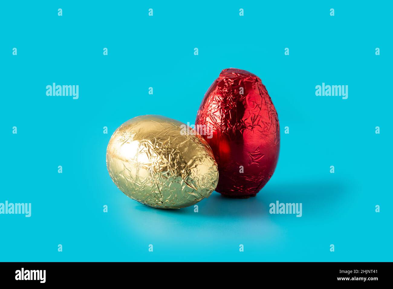 Red and golden Easter eggs on blue background Stock Photo