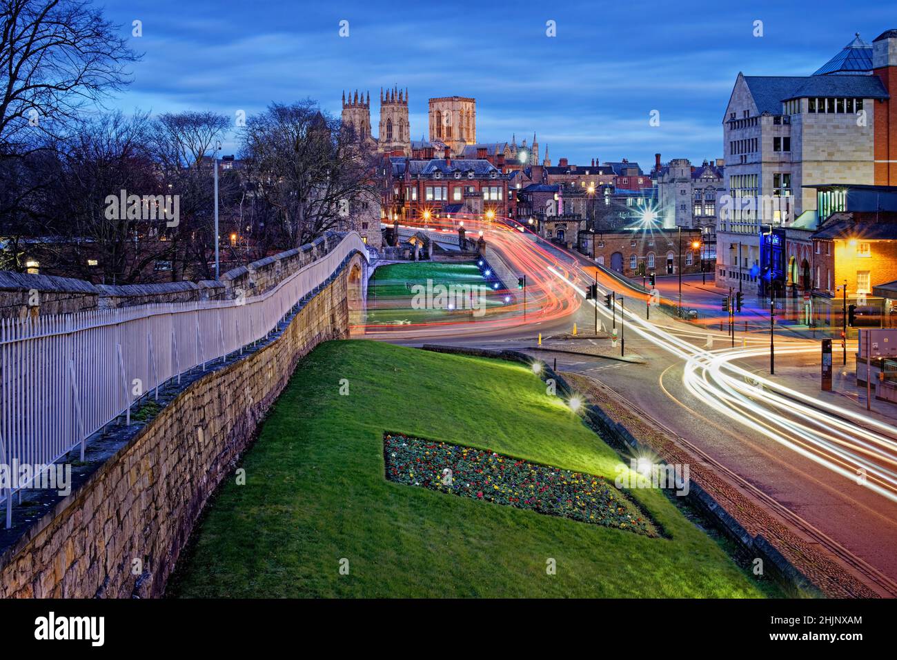 UK,North Yorkshire,York, City Walls with city centre and York Minster in the distance during blue hour. Stock Photo