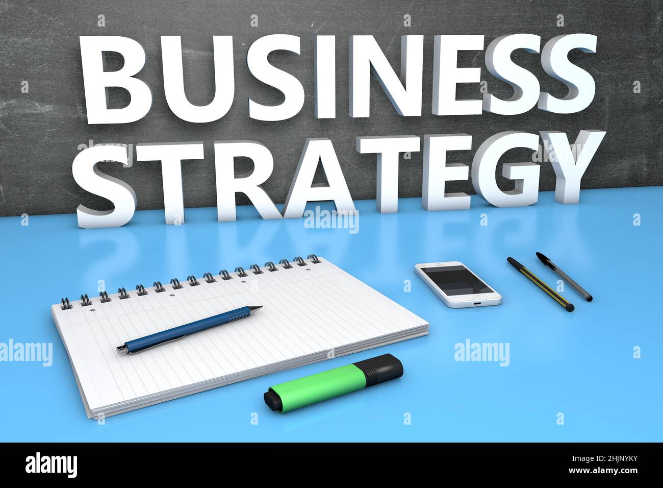 Business Strategy - text concept with chalkboard, notebook, pens and ...
