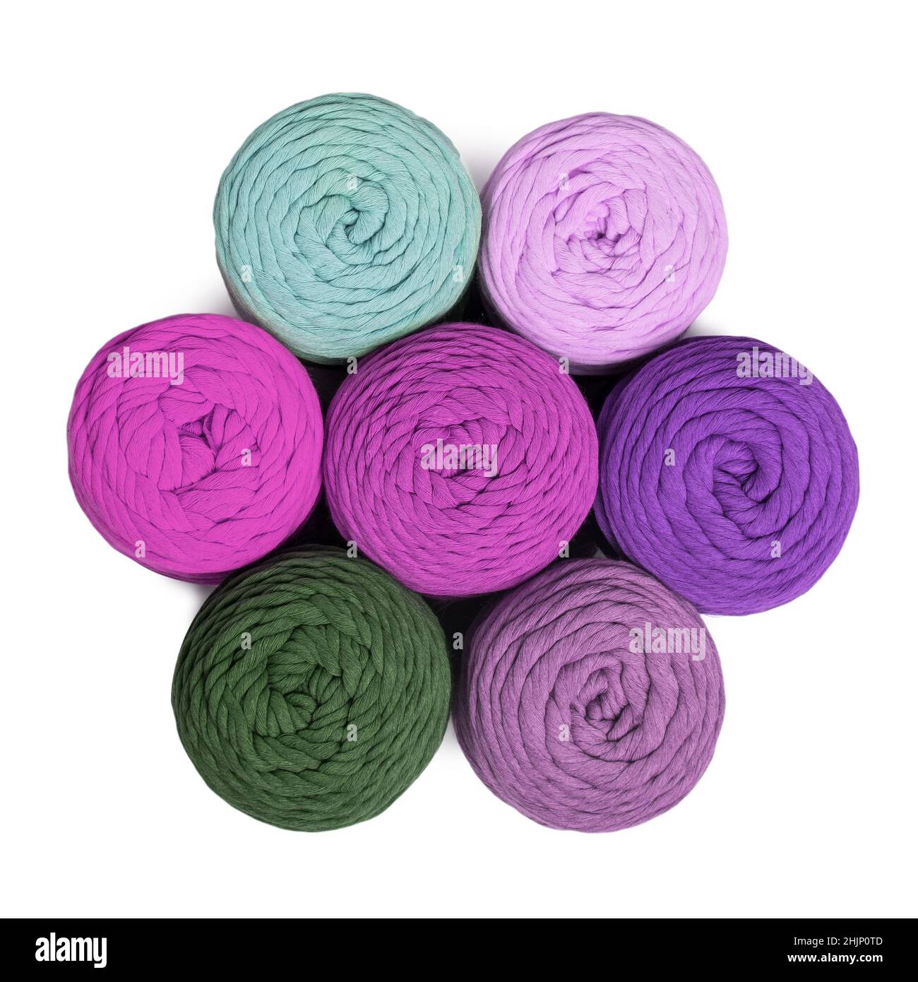 Colorful macrame yarns isolated on white background. Flat lay of natural cotton macrame yarn