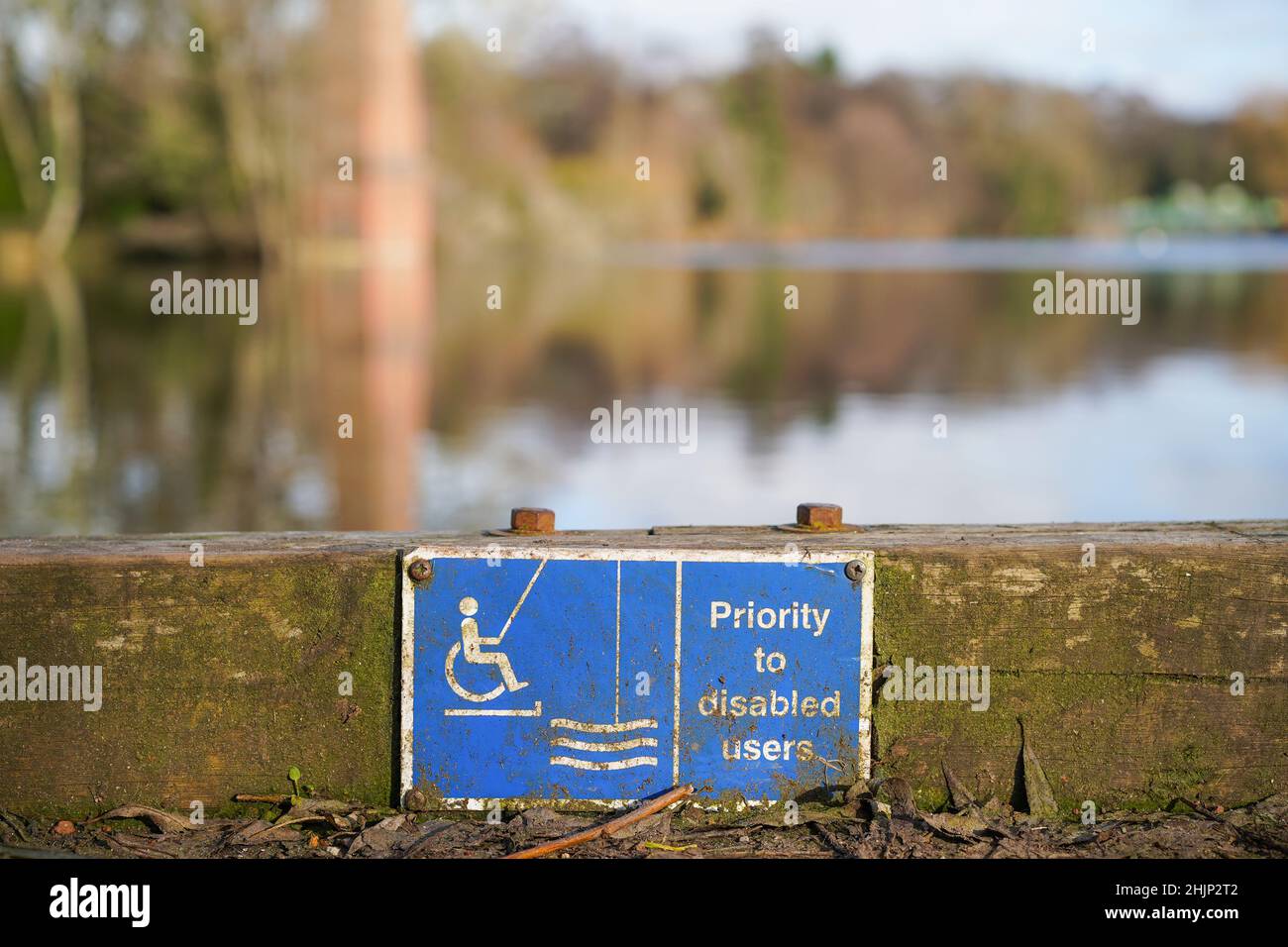 Blue sign for disabled anglers, fishermen - giving priority to disabled users at a popular fishing spot in the Midlands, UK. Stock Photo