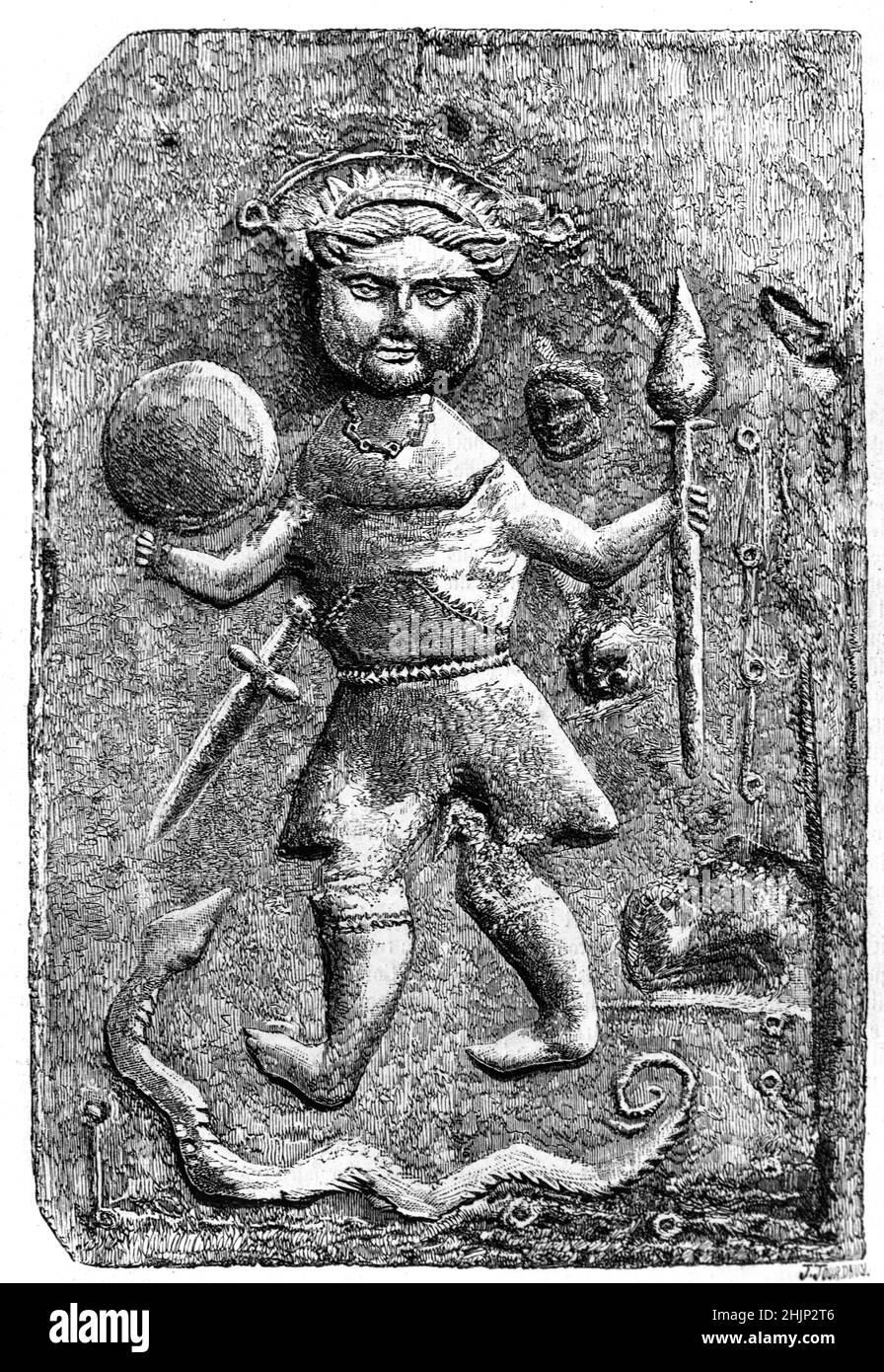 Antique Stone Bas-Relief showing a Strange Figure that has been variously interpreted as a Pagan God, possibly Tyllinus, a provincial rural impression of Christ, an Ancient Gaul, Gallic Soldier or Warrior carrying a Spear, Dagger and possibly a Shield, or a Hunter surrounded by a snake and severed heads. Made of brick 42cmx27cm, dated between c3rd and 5th centuries AD, the sculpture was discovered on the line of a Roman road near Issoire in Auvergne France. Vintage Illustration or Engraving 1865 Stock Photo
