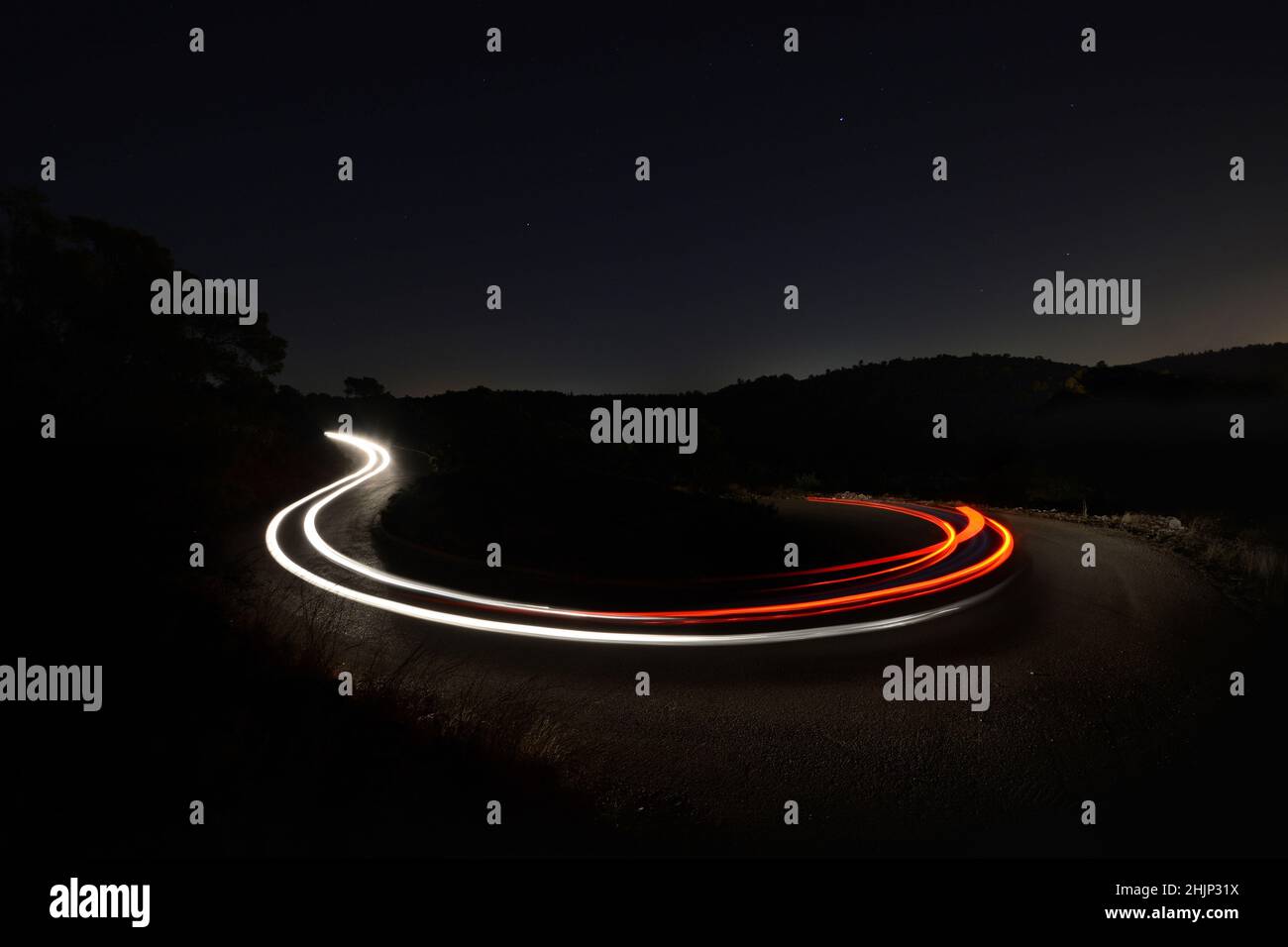 Light trail over a curvy road Stock Photo Alamy