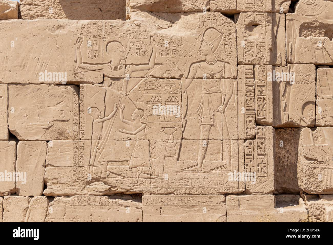 Ancient egyptian hieroglyphs carved on the stone wall in the Karnak ...