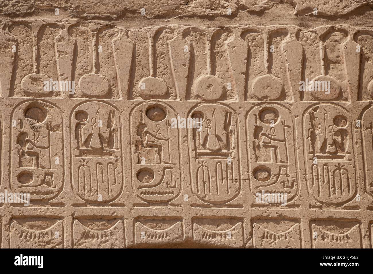 Ancient egyptian hieroglyphs carved on the stone wall in the Karnak ...