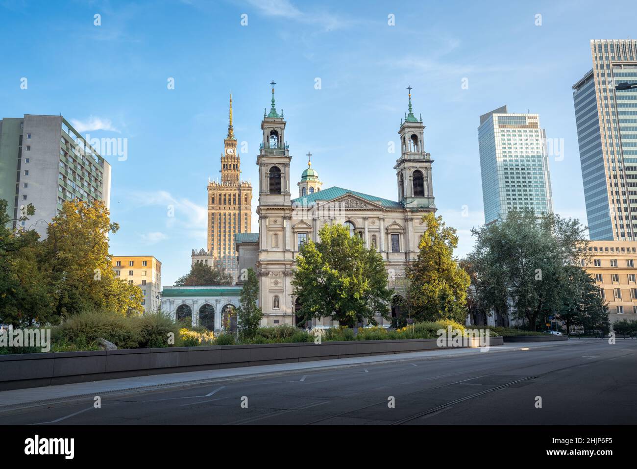 All Saints Church and Palace of Culture and Science - Warsaw, Poland Stock Photo