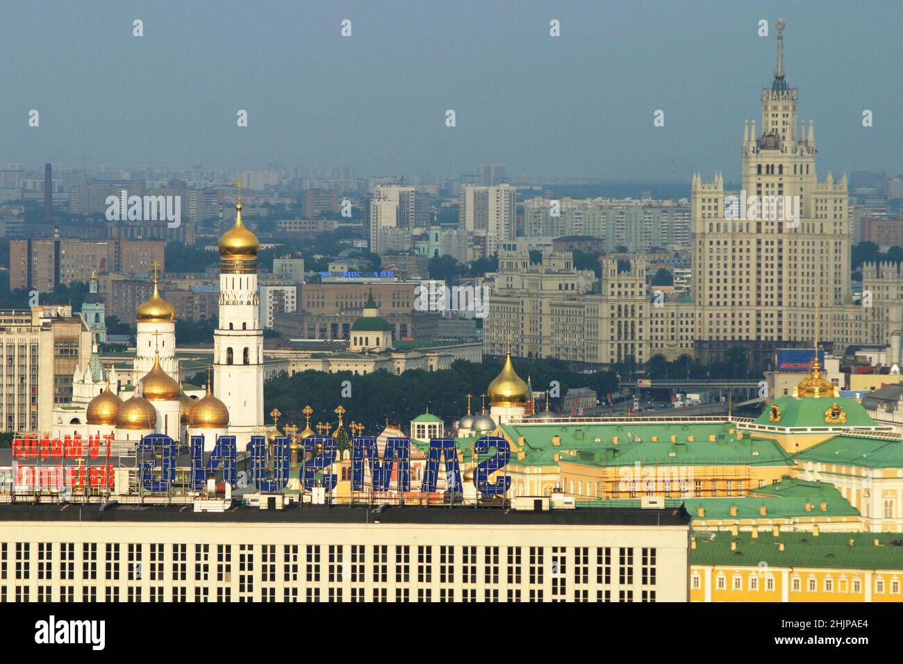 Moscow, Russia - May 20, 2020: Panoramic view on Kremlin palace, Ivan Veliki Church and belltower and stalinis hi-rise building. Light haze of smog. Stock Photo