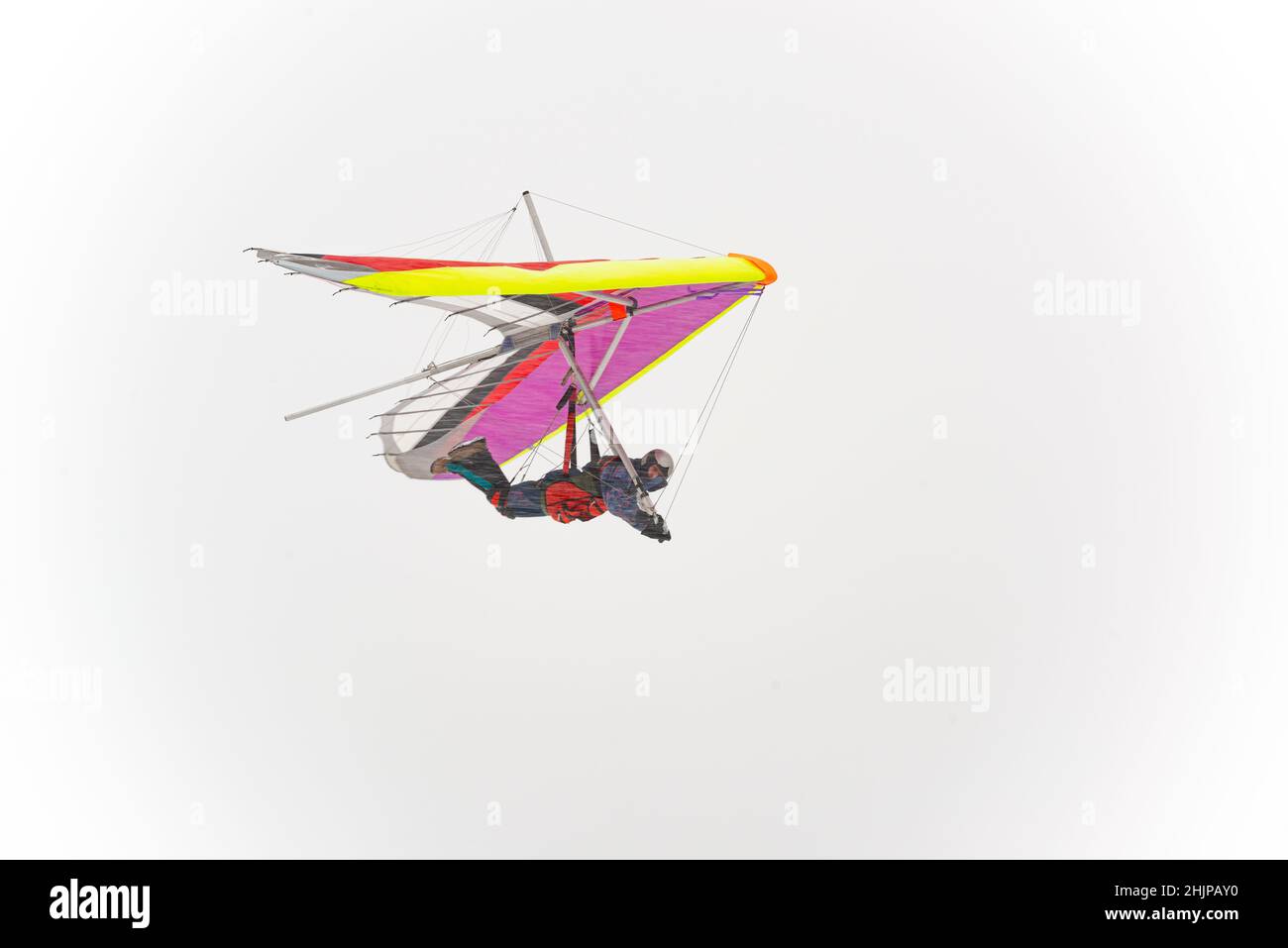 Colorful hang glider wing silhouette. Learning to fly Stock Photo