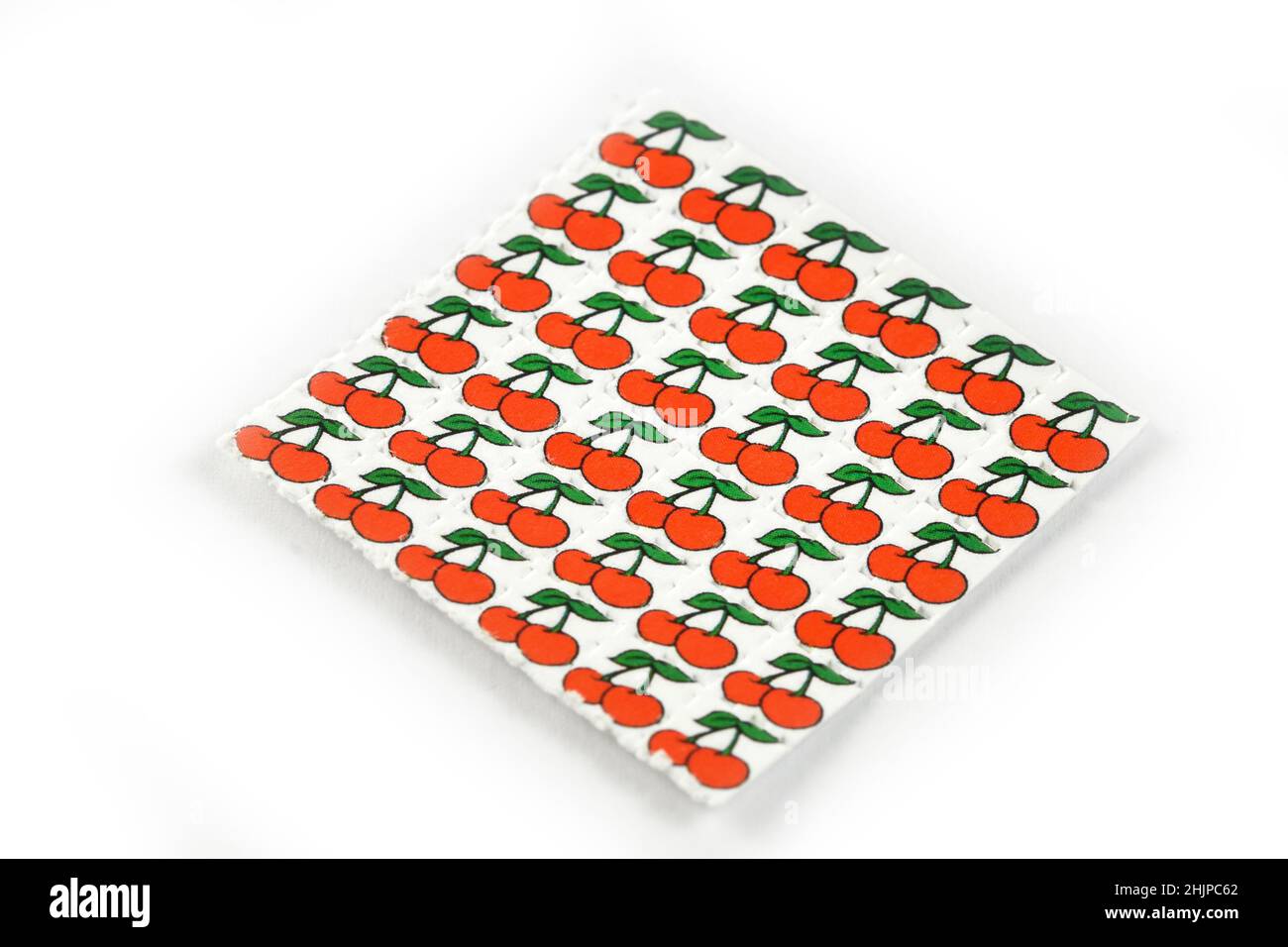 Cherries acid trips, Blotting paper impregnated with the drug L.S.D.- Lysergic acid diethylamide. Stock Photo