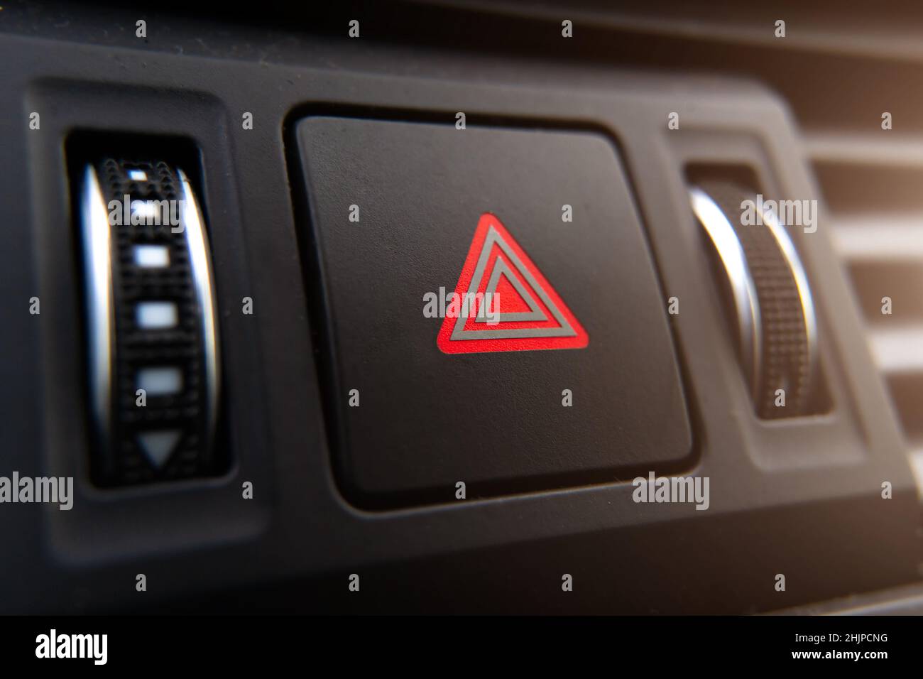 the emergency stop button of the car is a closeup on the dashboard