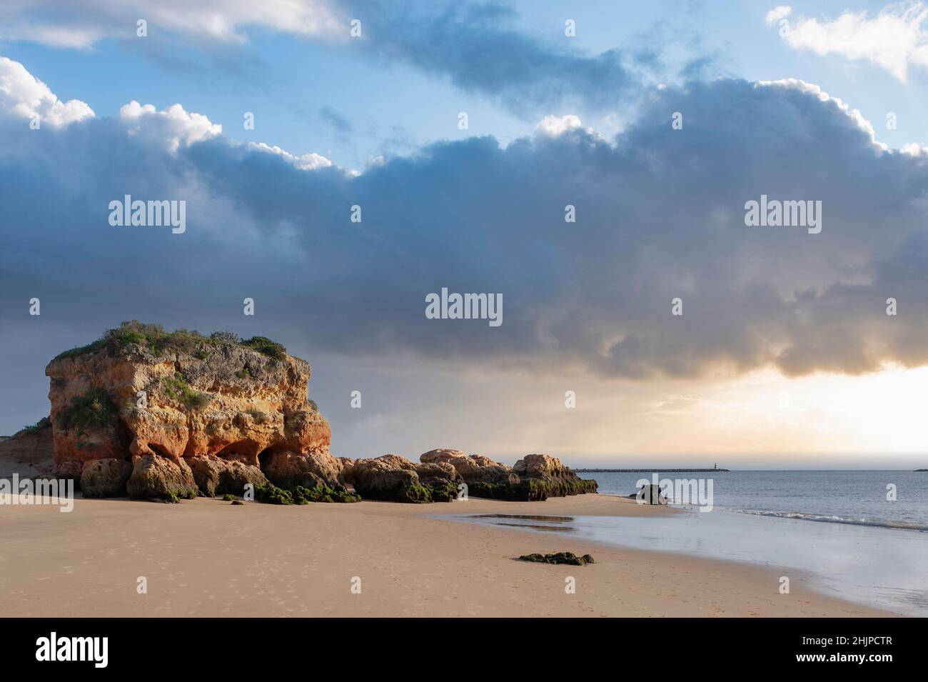 Single standing rock on the beach 'Praia Grande', Ferragudo, Algarve, Portugal, Europe Stock Photo