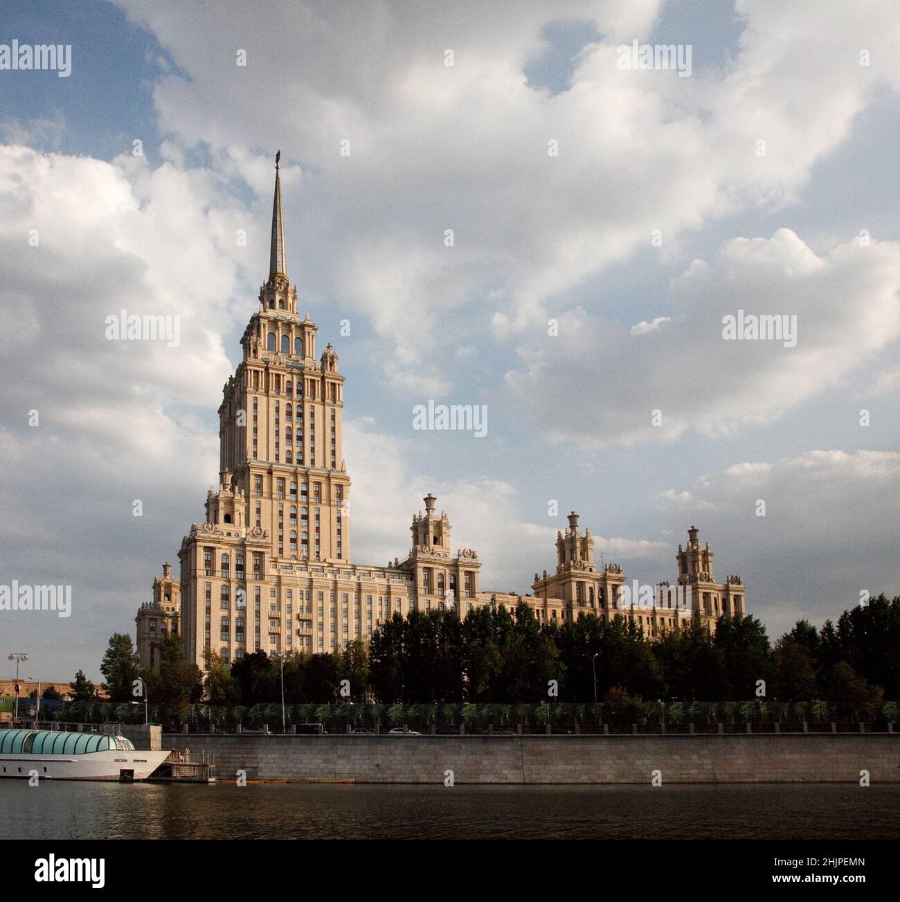 Stalinist skyscraper Hotel Ukraine on sunset. Cloudy sky with evening 
