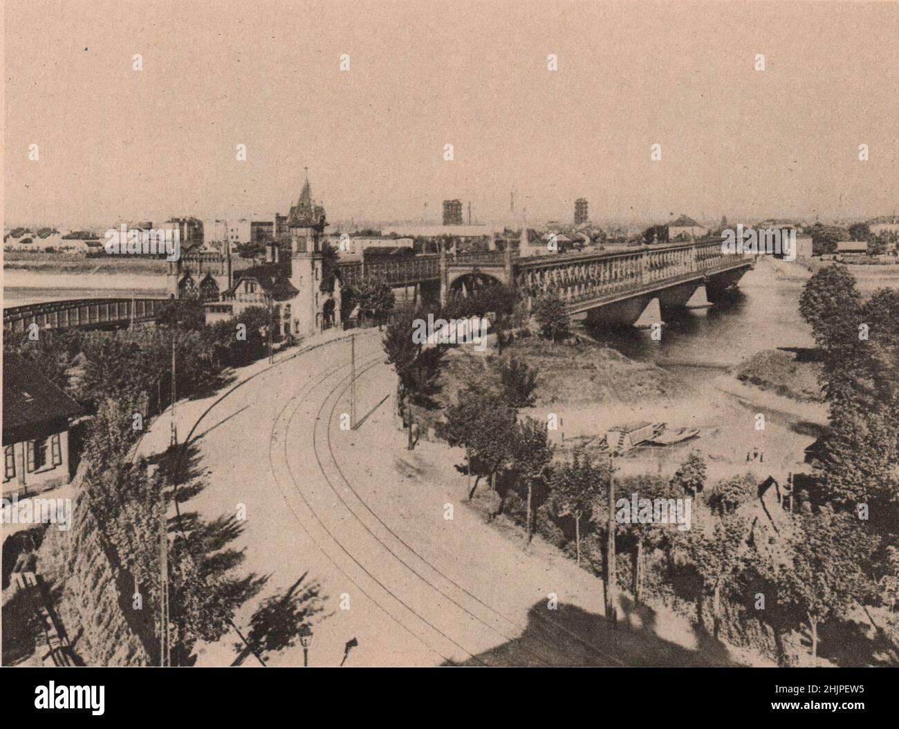 Two notable bridge lead from Strasbourg across the Rhine to Kehl; the iron railway bridge was erected by the Germans. Bas-Rhin. (1923) Stock Photo