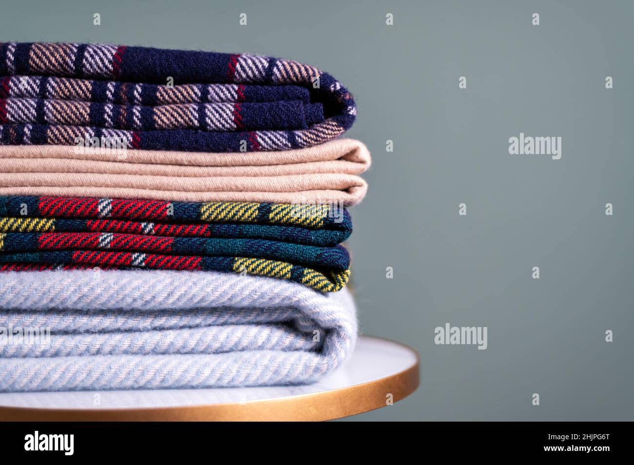 Stack of woolen checked blankets Stock Photo