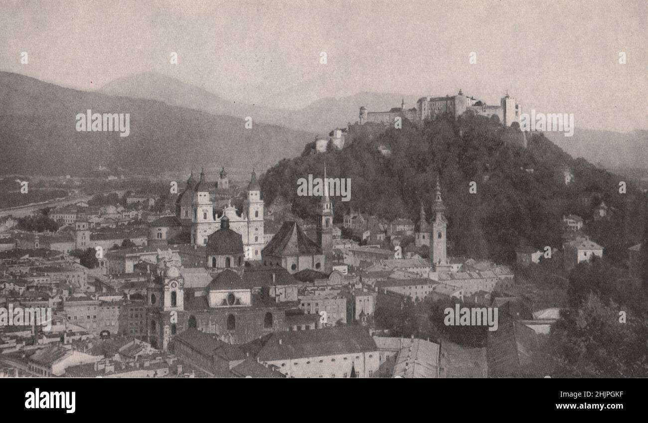 Older and main part of Salzburg at the foot of an Isolated Fortress-crowned hill. Austria (1923) Stock Photo