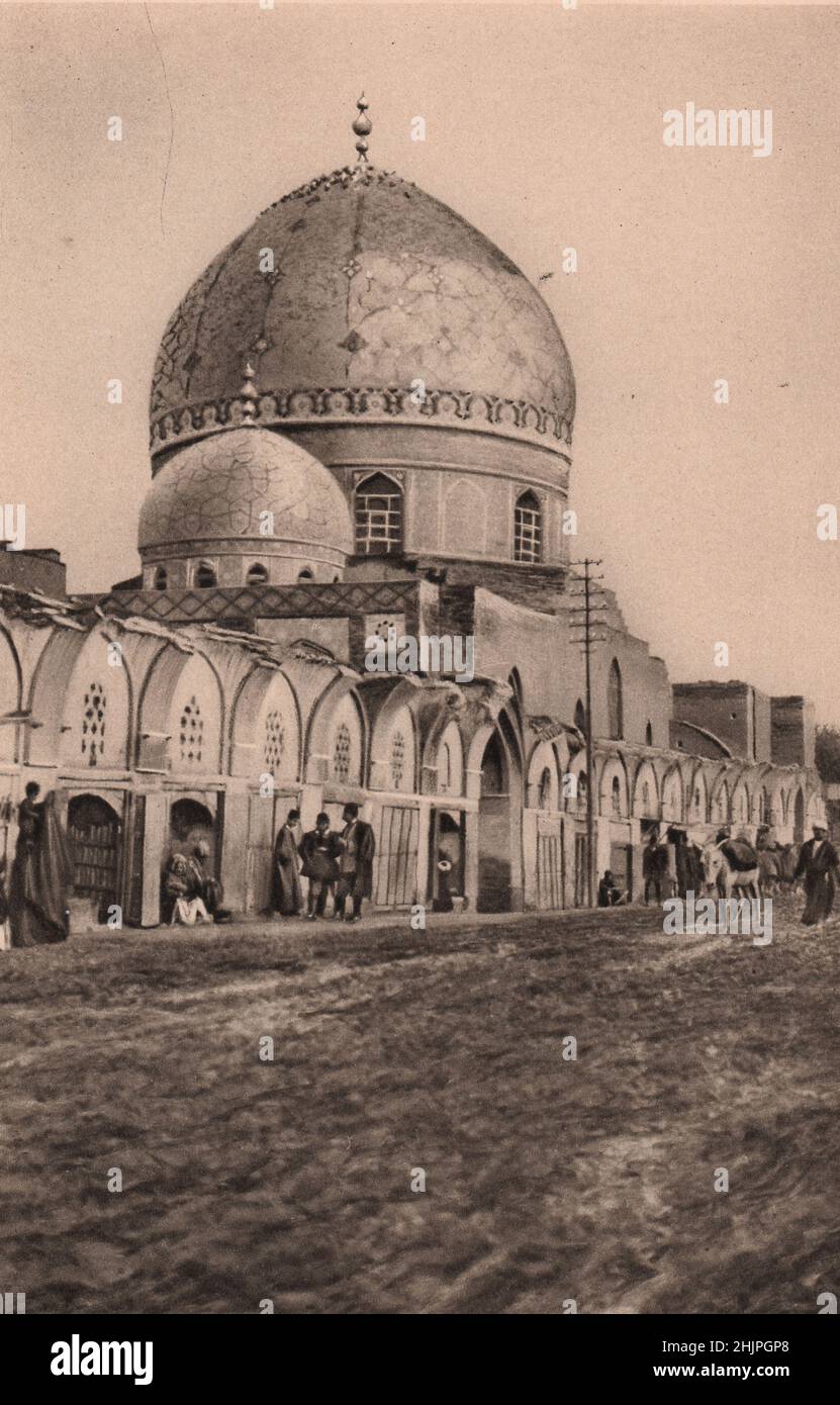 Baghdad. Sadly shorn of glory is the blue-domed Great Mosque. The ruined arches-ribs of its sawn skeleton-mark the line of the new street. Iraq (1923) Stock Photo
