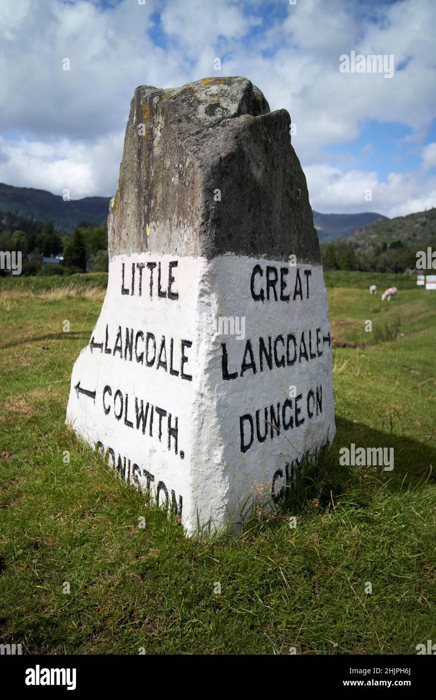 rock painted white with village and town directions langdale valley