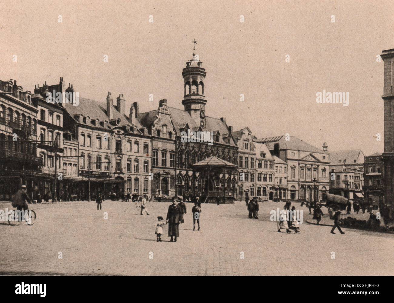 Few Places in Europe have seen the coming and going of so many armies as the Grand' place of Mons, the capital of Hainault. Belgium (1923) Stock Photo