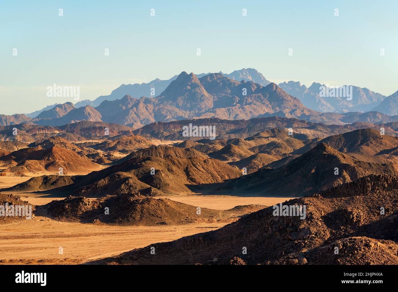 Eastern desert in Egypt with mountains and sand. Evening landscape looking like martian terrain simulation Stock Photo