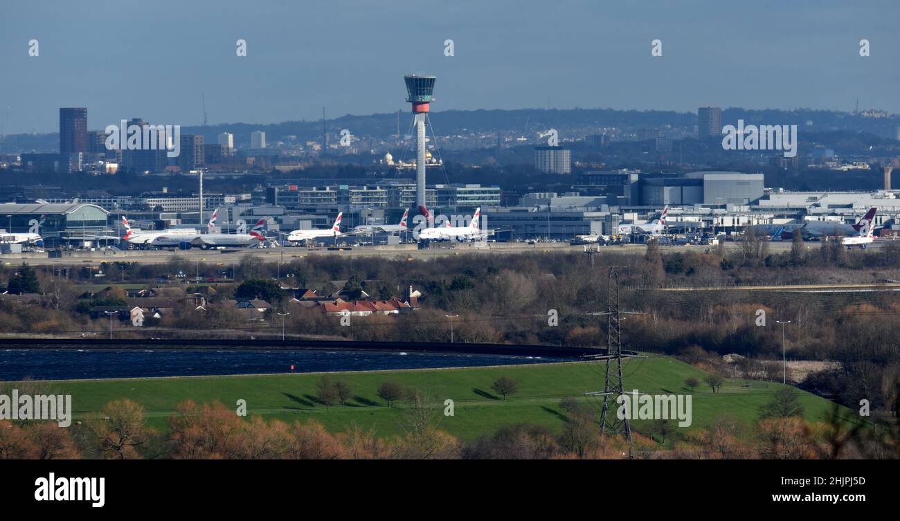 Aircraft clustered on the ground around the control tower at London's Heathrow airport Stock Photo