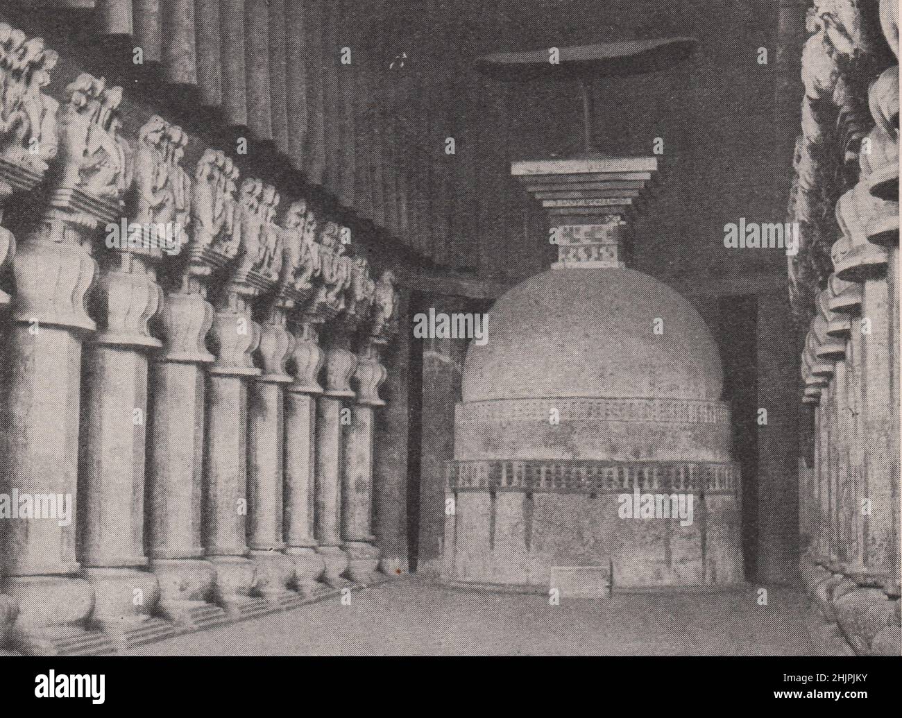 Within the sacred precincts of Buddha's cave temple at Karli. India. Bombay and Gujarat (1923) Stock Photo