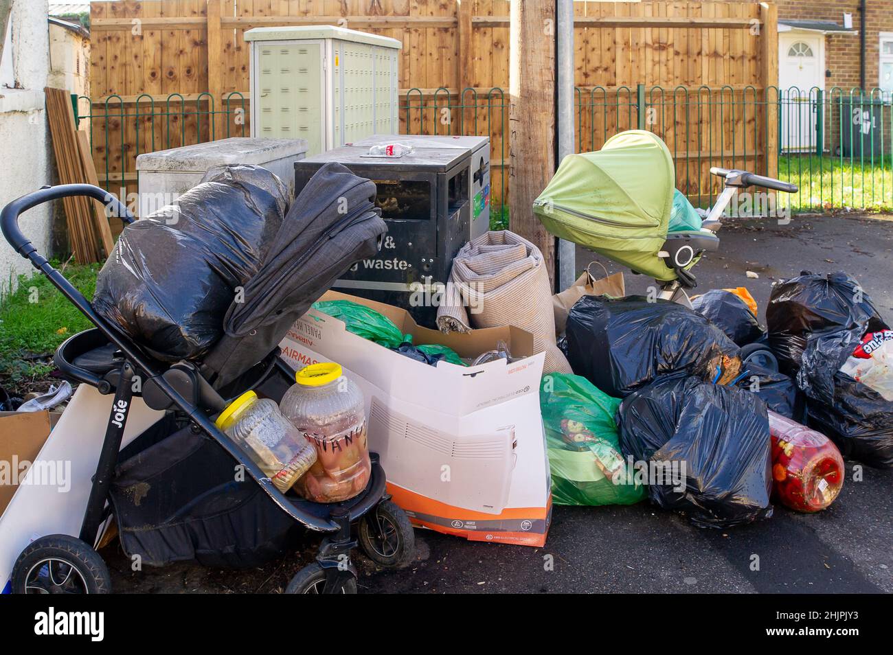 Slough, Berkshire, UK. 31st January, 2022. New figures from the Department for Environment, Food and Rural Affairs (Defra) state that there were 10,547 incidents of fly tipping in Berkshire between 2020 and 2021. Residents continue to fly tip rubbish in Chalvey, Slough despite the area being under surveillance and clear warning signs of fines of up £50,000 or 12 months imprisonment for those convicted of fly tipping. Ironcially Chalvey has a huge free public waste tip for household waste. Credit: Maureen McLean/Alamy Live News Stock Photo