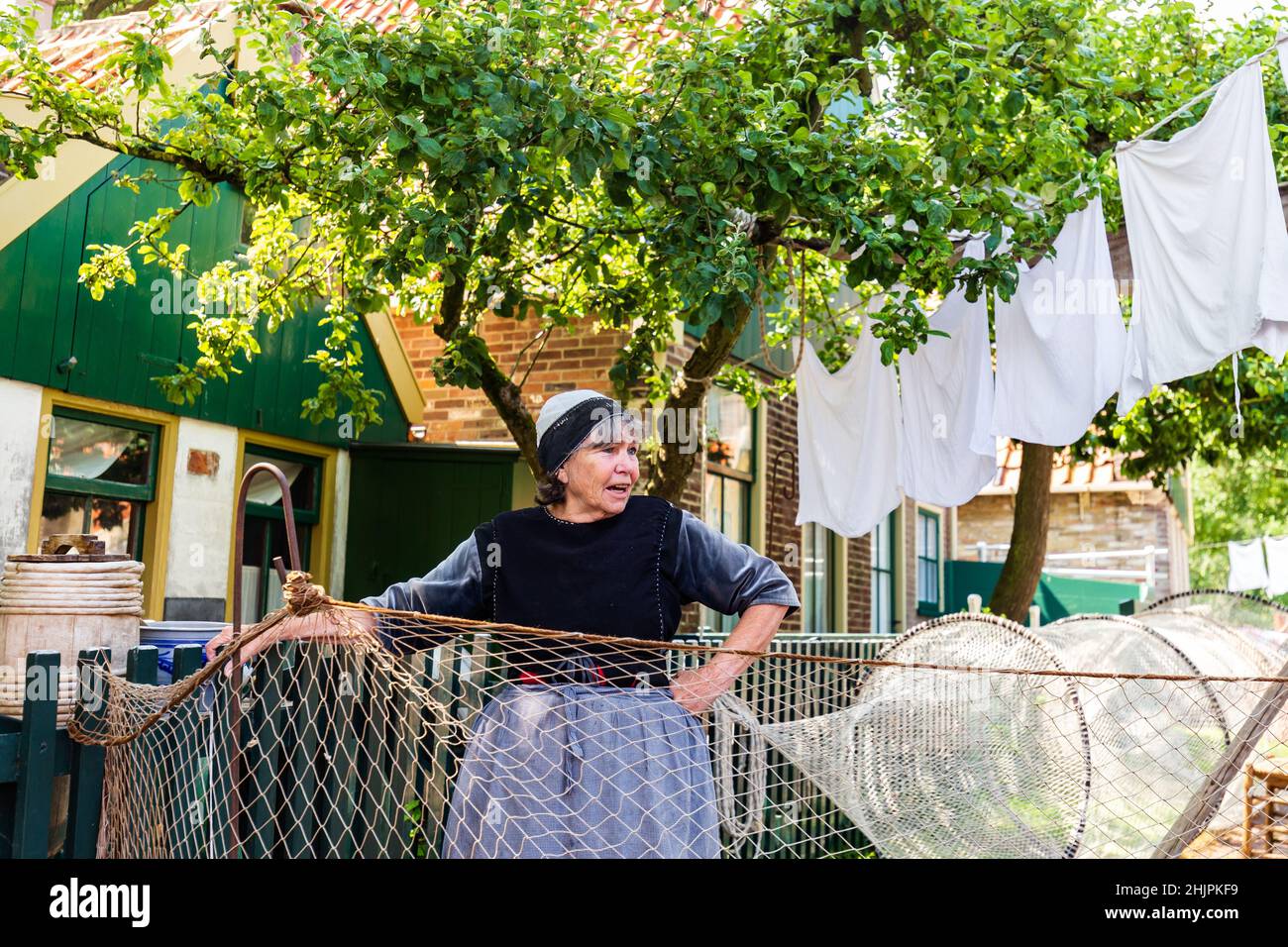 Enkhuizen, The Netherlands - July 7, 2021: Scenics with role players in traditional fishermans village in Enkhuizen North-Holland in The Netherlands Stock Photo