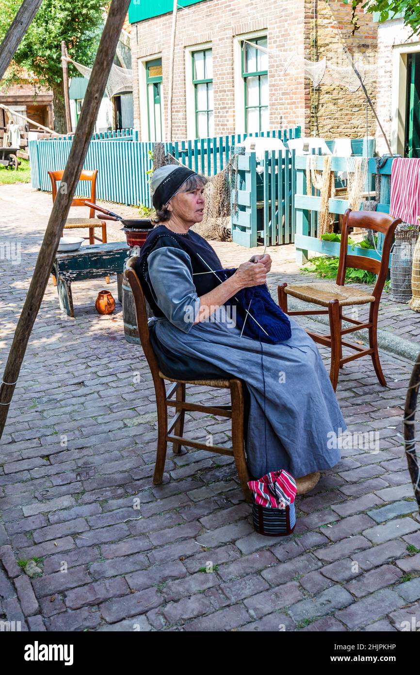 Enkhuizen, The Netherlands - July 7, 2021: Scenics with role players in traditional fishermans village in Enkhuizen North-Holland in The Netherlands Stock Photo