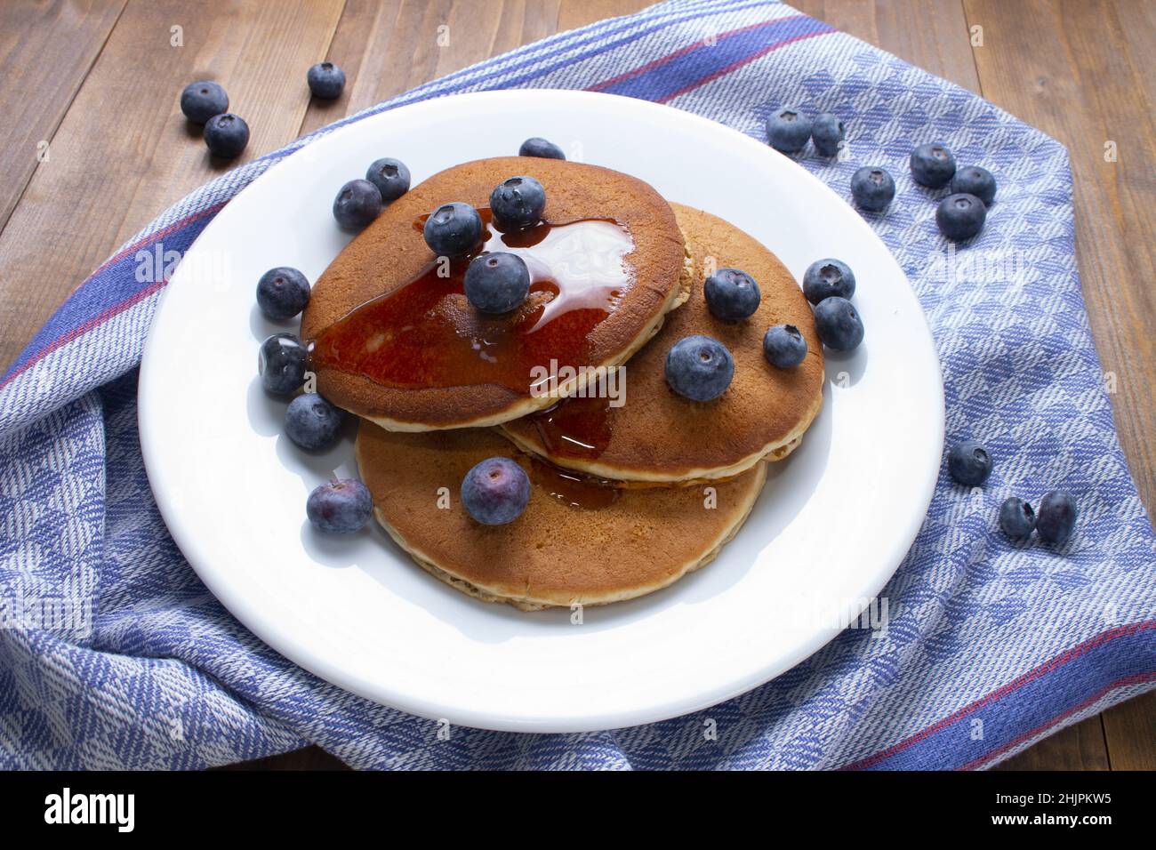homemade pancake with sweet honey and blueberries on a plate Stock Photo