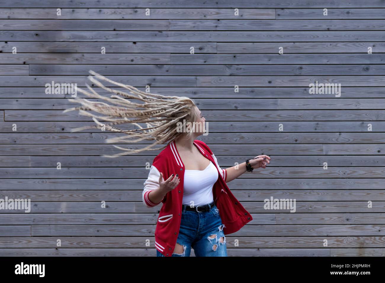blonde woman with dreadlocks wagging her hair Stock Photo - Alamy