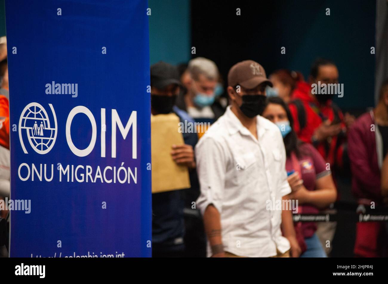 Venezuelan migrants queue in long lines for them to receive their temporary residence and working permits on January 27, 2022. Colombia Migration is o Stock Photo