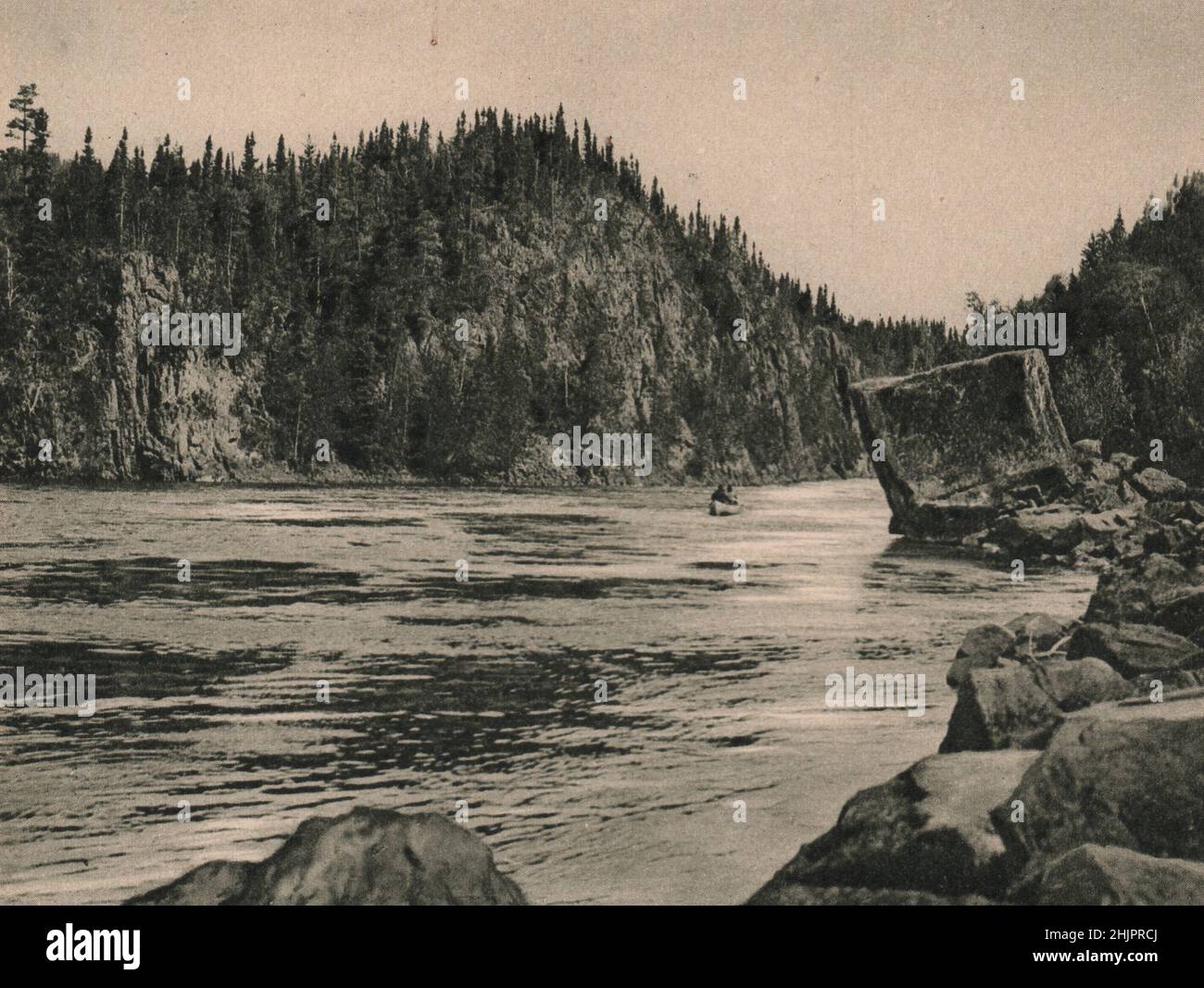 Romantic scenery, including this bizarre Split Rock, frames the Nipigon River in its course from lake Nipigon to lake Superior. Canada (1923) Stock Photo