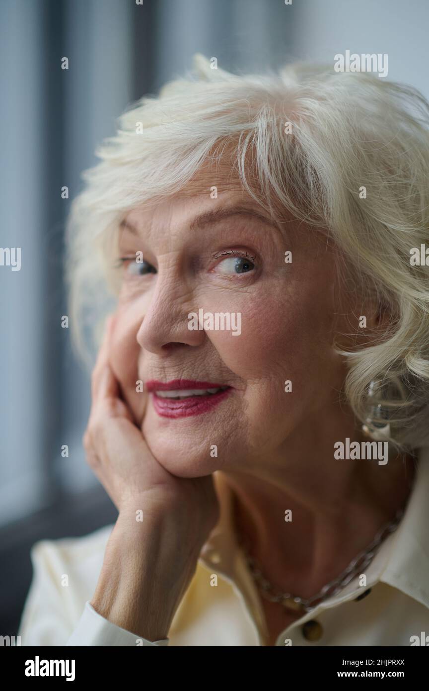 Close-up face of elderly beautiful woman looking at camera Stock Photo