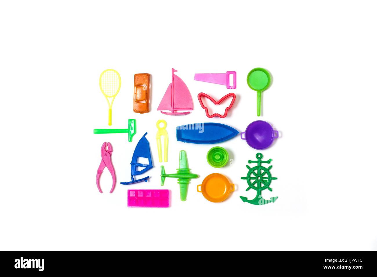 Colored small plastic toys on a white background Stock Photo