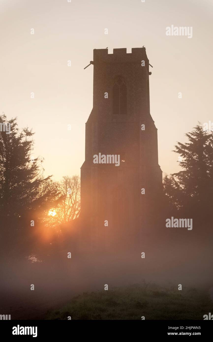 Church at sunrise with mist  Hickling Norfolk UK Stock Photo
