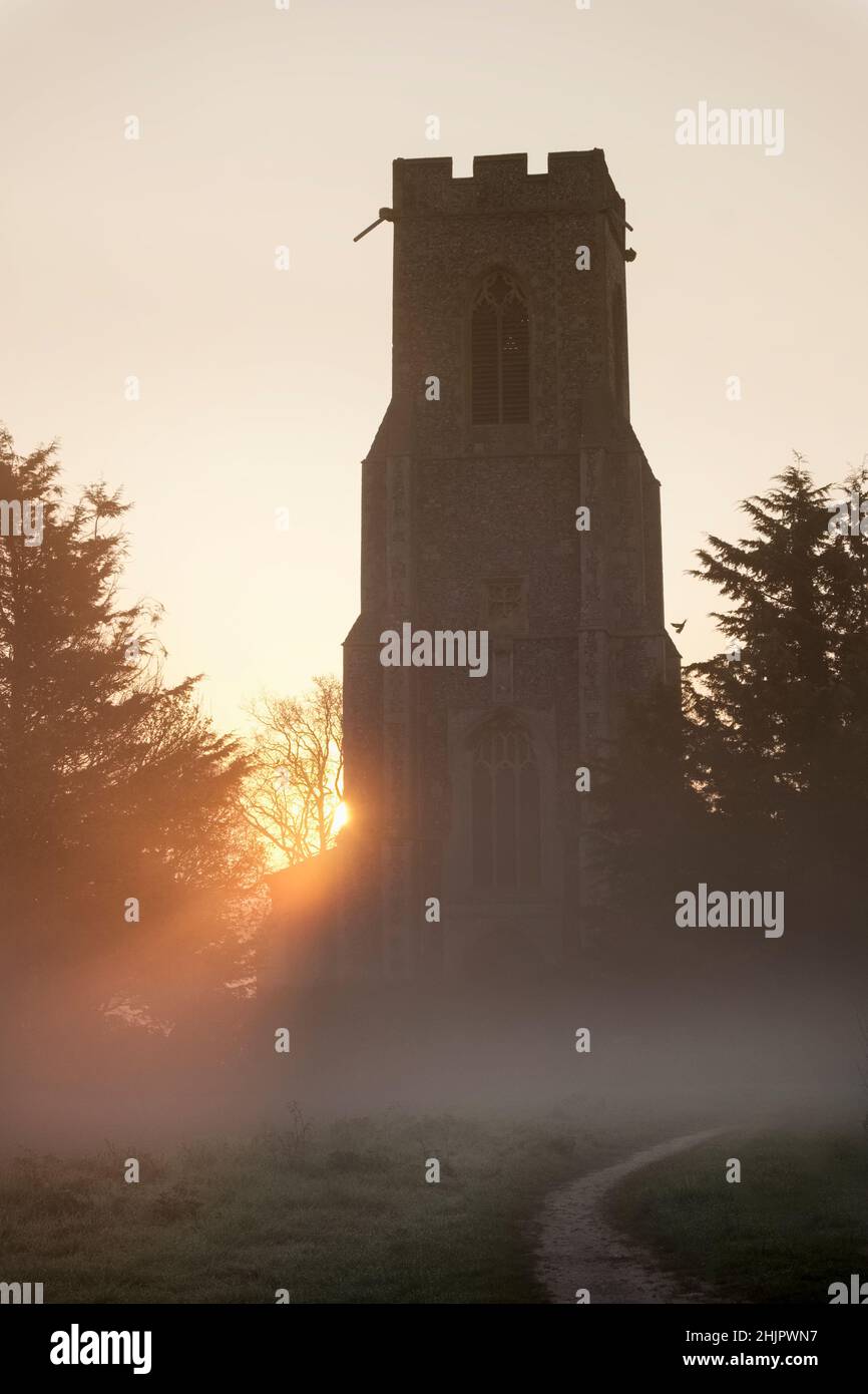 Church at sunrise with mist  Hickling Norfolk UK Stock Photo