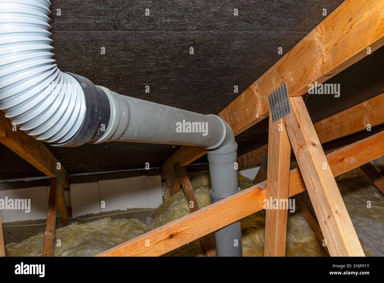 The ends of the plastic pipes connected to the roof tile chimney for sewer ventilation Stock