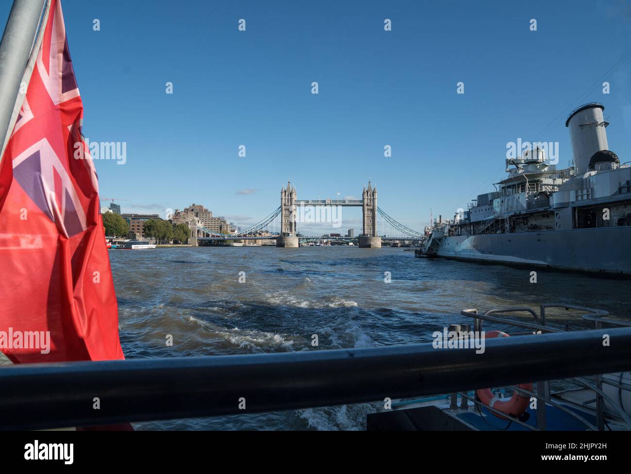HMS Belfast moored near Tower Bridge on the River Thames, London Stock Photo